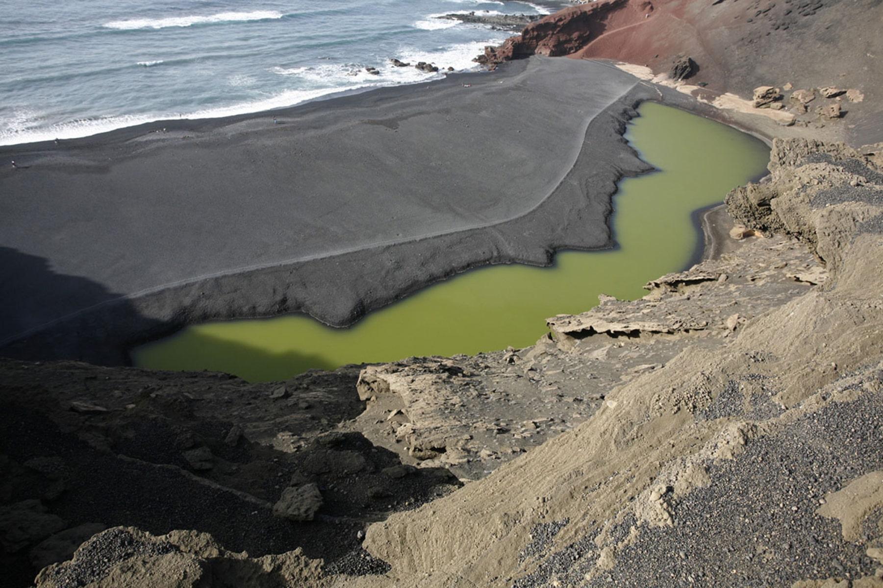Green lagoon inside a volcanic crater at El Golfo